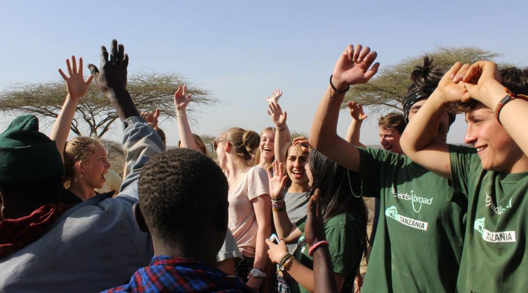 A local community in Tanzania meets up with Projects Abroad volunteers. Projects Abroad volunteers in Tanzania are dancing with the local community they are working with.